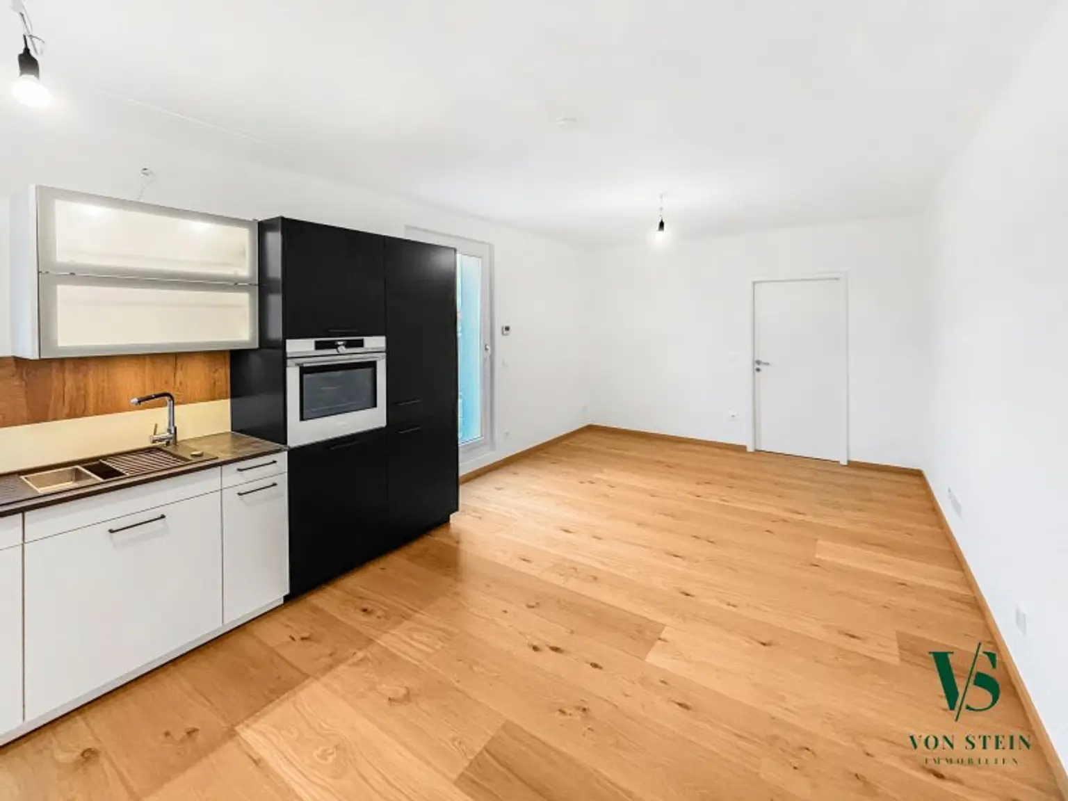 Wohnzimmer mit Wohnküche