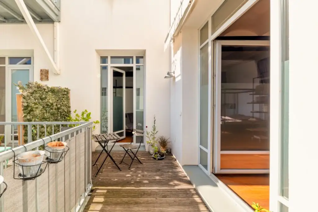 Stilvolle Loft-Wohnung mit Westbalkon & Premiumausstattung in historischem Fabriksgebäude
