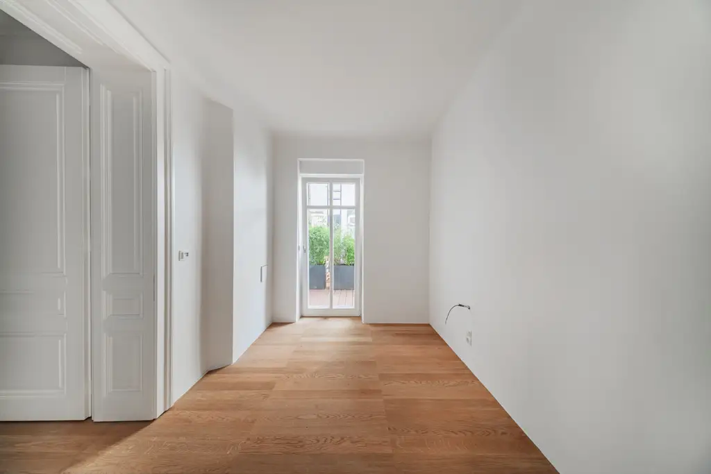 Exklusive Gartenwohnung am Rochusmarkt – Wohnen im spätbarocken Juwel