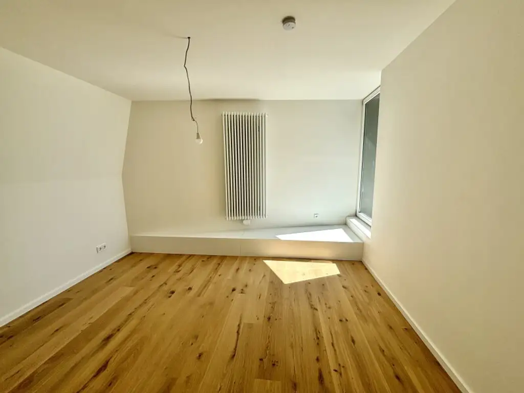 Exklusive Erstbezugs-Dachgeschosswohnung mit Loggia & Seeblick in zentraler Lage von Neusiedl