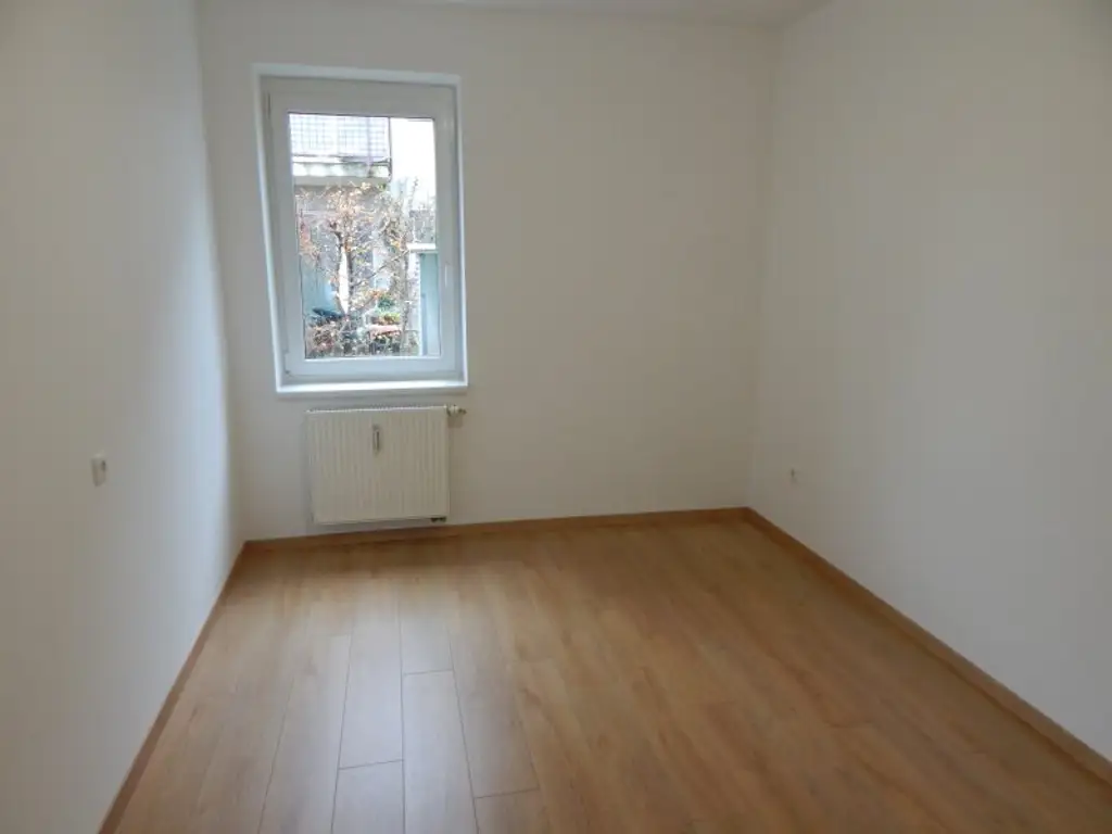 "PROVISIONSFREI" Helle und ruhige Garten-/Terrassenwohnung mit Tiefgaragenplatz