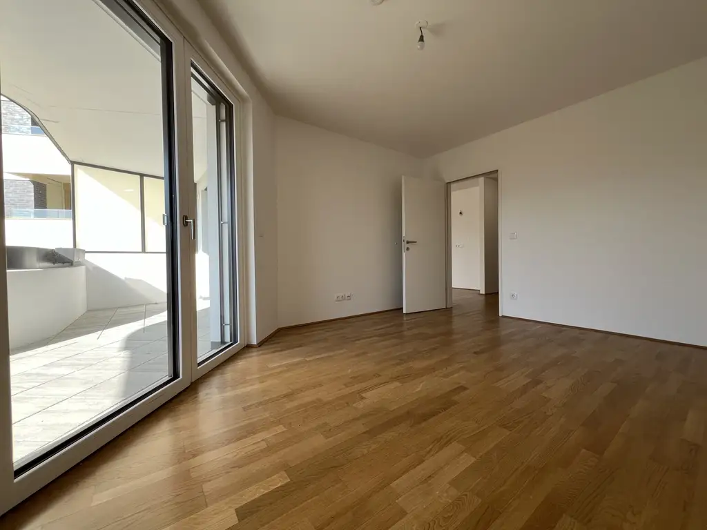 EXKLUSIVER ERSTBEZUG nahe Hauptbahnhof - Sonnige Wohnung mit großzügiger Freifläche und Küche in einem modernen Neubauprojekt