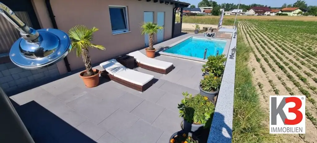 K3 präsentiert Wohnung mit Pool, Teich, Einliegerwohnung und Doppelcarport in absoluter Ruhelage